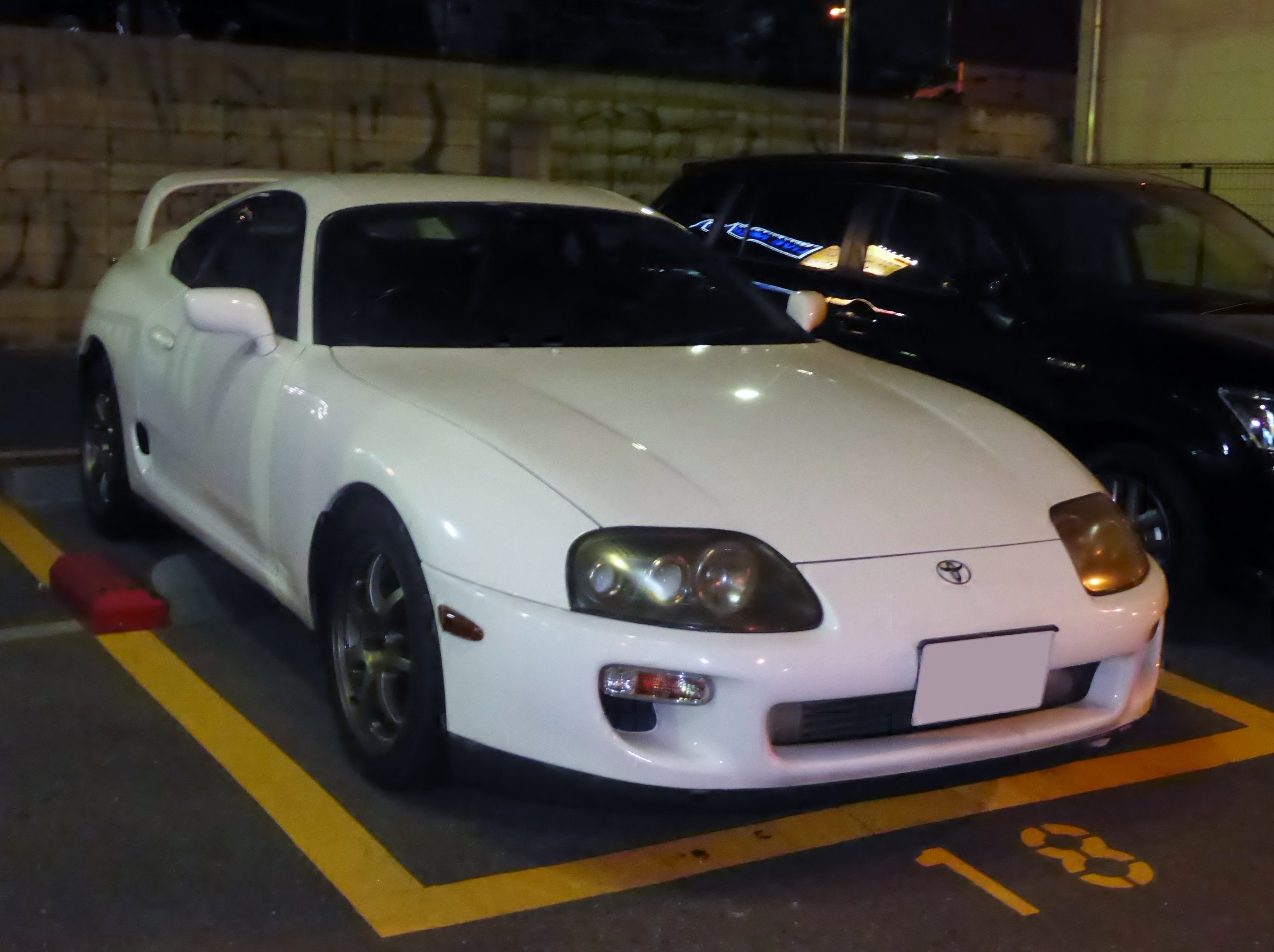 White Toyota Supra A80 parked at night